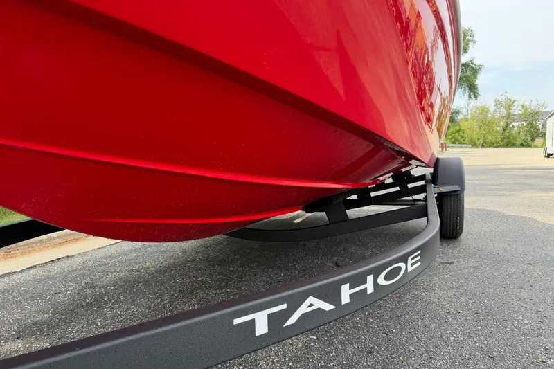 Slide: The Image of Red 2027 Tahoe T18 boat on trailer, close-up view. - 3