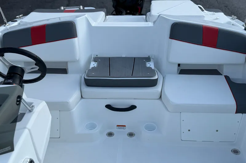 Slide: The Image of Interior of 2027 Tahoe T18 boat with white and red seating arrangement. - 18