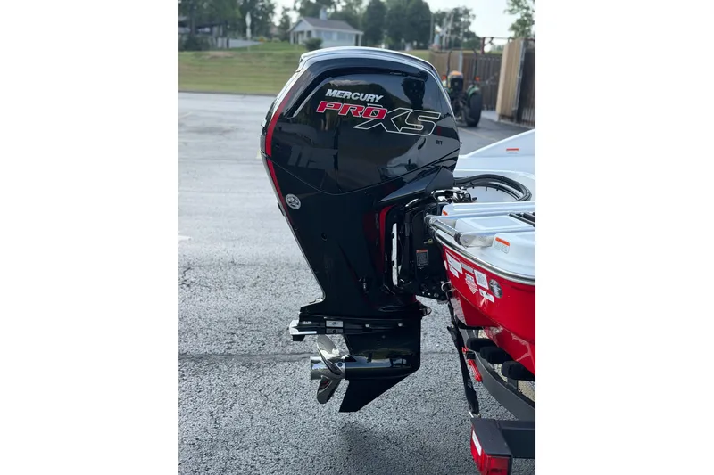 Slide: The Image of 2027 Tahoe T18 boat with Mercury Pro XS outboard motor, parked on asphalt. - 6