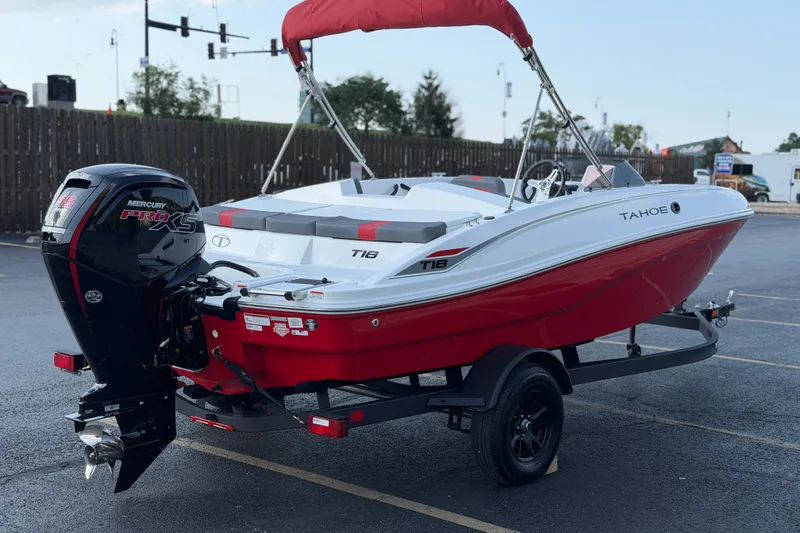 Slide: The Image of 2027 Tahoe T18 boat with Mercury Pro XS engine, parked on trailer. - 7