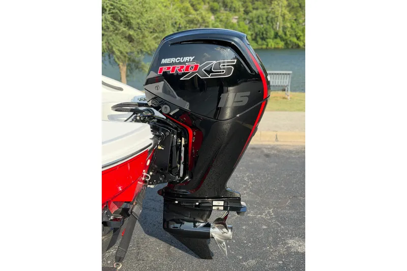 Slide: The Image of 2027 Tahoe T18 with Mercury Pro XS 115 outboard motor, parked near a lake. - 4