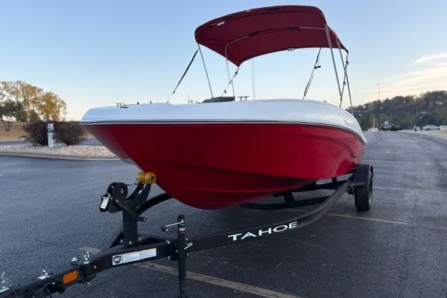 Slide: The Image of 2027 Tahoe T18 boat with red hull and canopy on a trailer. - 7