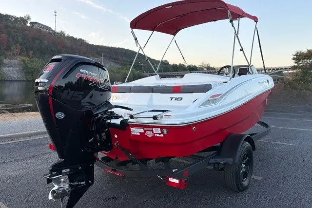 Slide: The Image of 2027 Tahoe T18 boat with red hull and Mercury 115 Pro XS engine on trailer. - 11