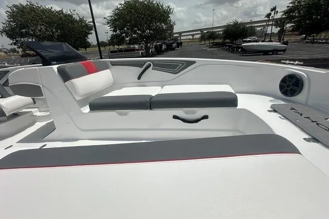 Slide: The Image of 2027 Tahoe T21 boat interior with gray and white seating, outdoor setting. - 5
