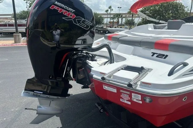 Slide: The Image of 2027 Tahoe T21 boat with Mercury Pro XS engine, parked outdoors. - 3