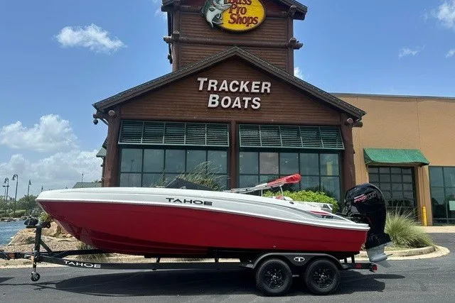 The Image of 2027 Tahoe T21 boat on trailer outside Tracker Boats store. - 0