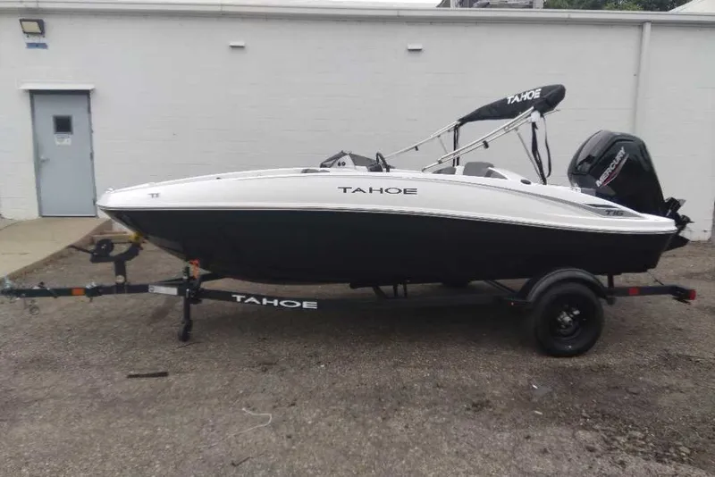 The Image of 2027 Tahoe T16 boat on trailer, parked outdoors. - 0