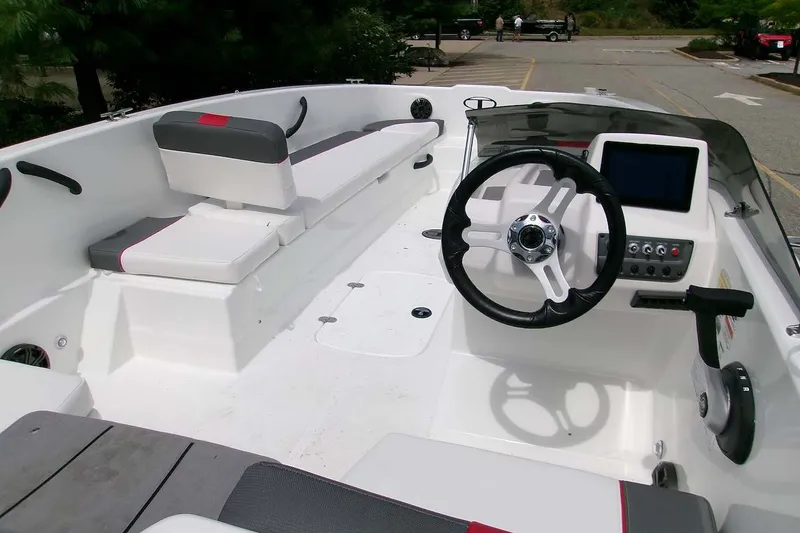 Slide: The Image of Interior view of 2027 Tahoe T18 boat with steering wheel and seating. - 5