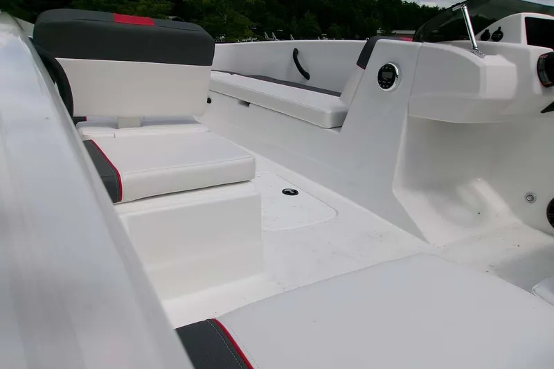 Slide: The Image of Interior of 2027 Tahoe T18 boat with white and black seating. - 7
