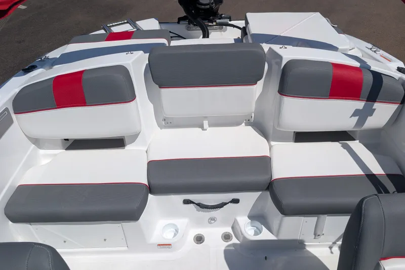 Slide: The Image of 2027 Tahoe T21 boat interior with gray and red cushioned seating. - 13