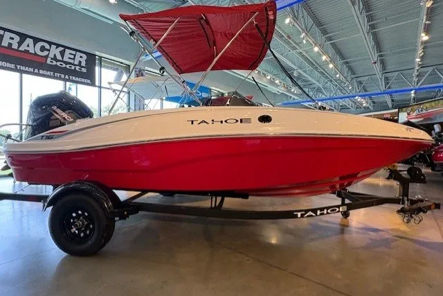 The Image of 2027 Tahoe T16 boat with red hull and canopy in showroom. - 0
