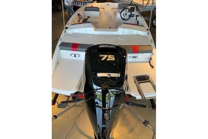 Slide: The Image of 2027 Tahoe T16 boat with Mercury 75 engine, sleek design, and modern features. - 2