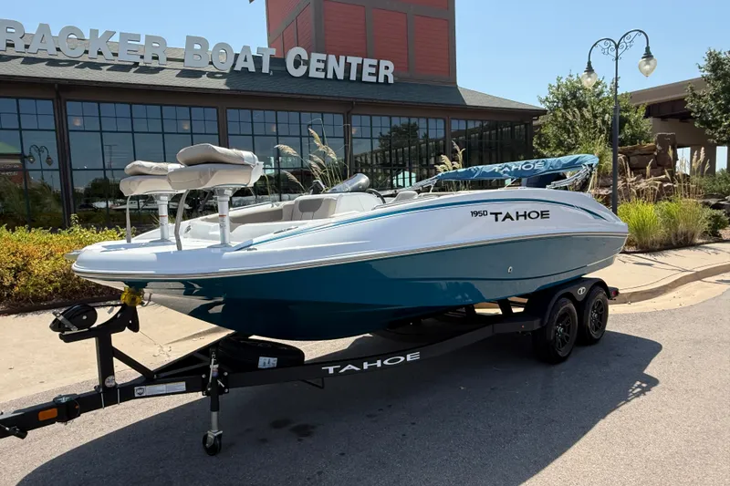 Slide: The Image of 2027 Tahoe 1950 boat on trailer outside Tracker Boat Center. - 1