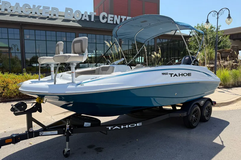 Slide: The Image of 2027 Tahoe 1950 boat displayed at Tracker Boat Center, featuring sleek design and modern seating. - 6