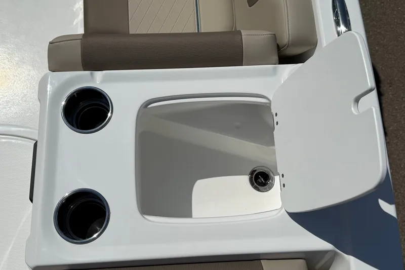 Slide: The Image of Tahoe 1950 boat interior with cup holders and storage compartment, 2027 model. - 12
