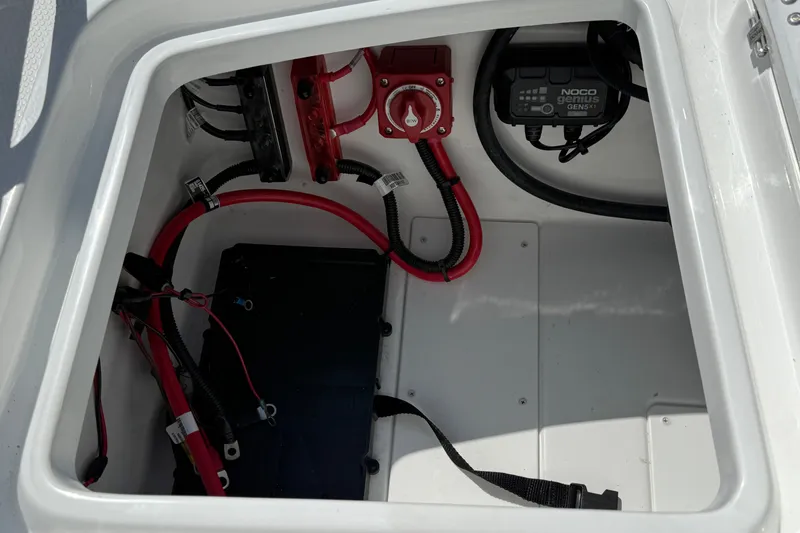 Slide: The Image of Electrical compartment of a 2027 Tahoe 1950 boat with wiring and battery components. - 15