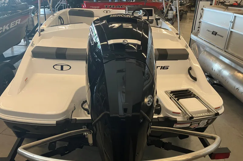 Slide: The Image of 2027 Tahoe T16 boat with Mercury 75 engine in showroom. - 1