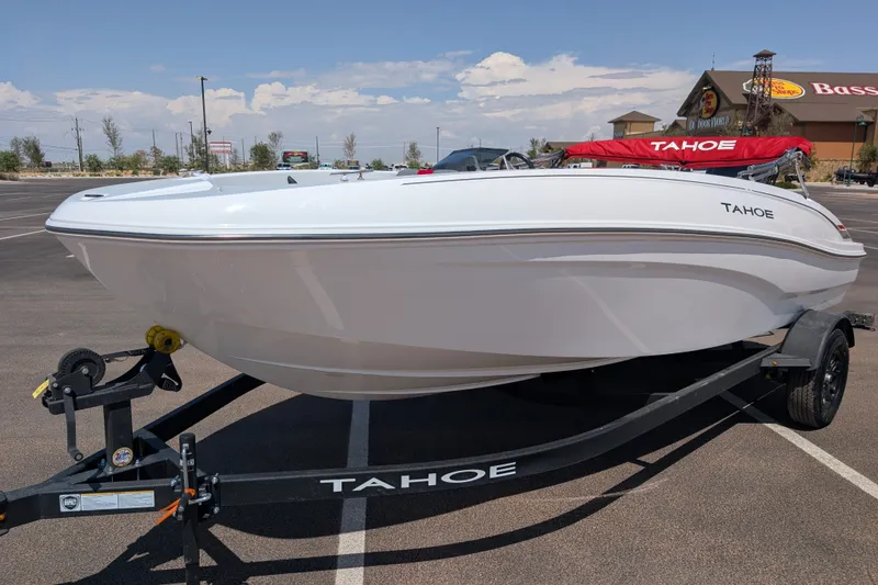 Slide: The Image of 2027 Tahoe T18 boat on trailer in parking lot, sunny day. - 1