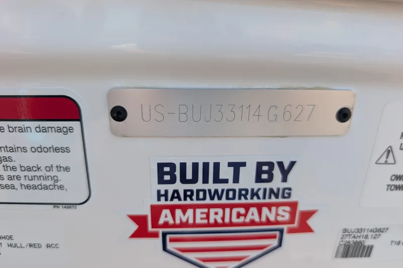 Slide: The Image of 2027 Tahoe T18 identification plate with 'Built by Hardworking Americans' label. - 16