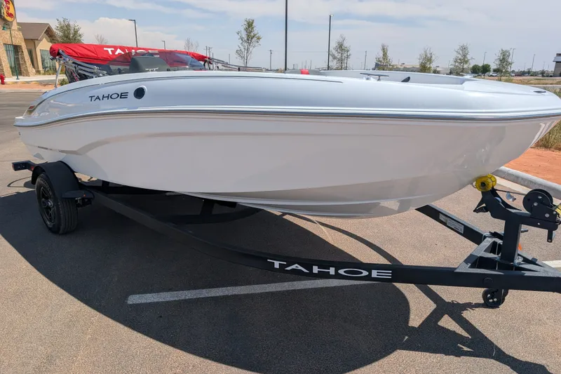 Slide: The Image of 2027 Tahoe T18 boat on trailer in parking lot, sunny day. - 3