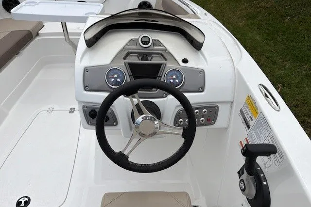 Slide: The Image of Steering console of a 2027 Tahoe 1950 boat with modern controls and dashboard. - 112