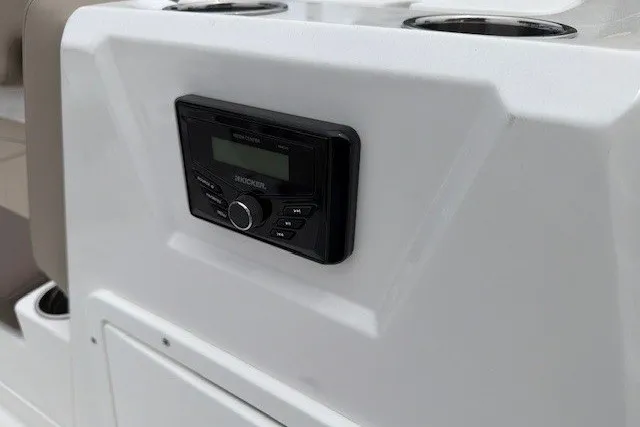 Slide: The Image of 2027 Tahoe 1950 boat console with built-in stereo system. - 113