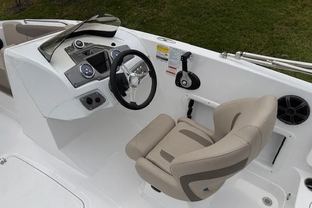 Slide: The Image of Modern Tahoe 1950 boat cockpit with steering wheel and beige captain's chair, 2027 model. - 110