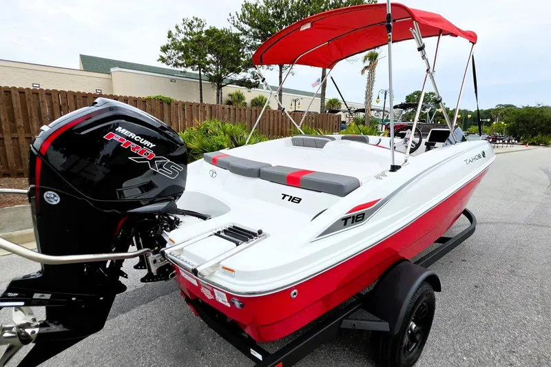 Slide: The Image of 2027 Tahoe T18 boat with red and white design, featuring a Mercury Pro XS engine. - 4