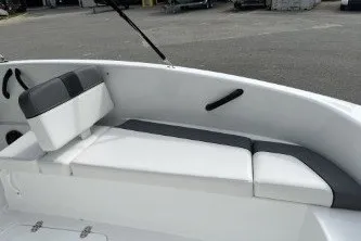 Slide: The Image of 2027 Tahoe T16 boat interior with white and gray seating. - 4
