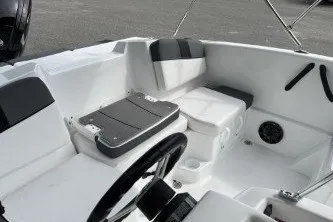 Slide: The Image of 2027 Tahoe T16 boat interior with seating, steering wheel, and storage compartments. - 9