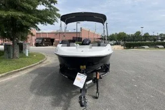 Slide: The Image of 2027 Tahoe T16 boat on trailer in parking lot, under cloudy sky. - 3