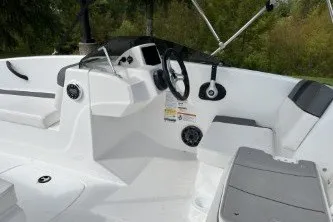 Slide: The Image of 2027 Tahoe T16 boat interior with steering wheel and seating, featuring modern design elements. - 8