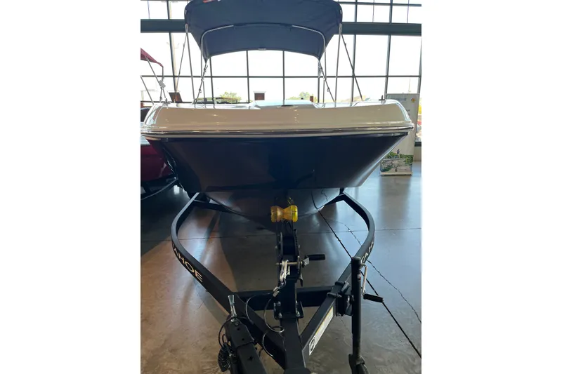 Slide: The Image of 2027 Tahoe T18 boat on trailer in showroom, front view. - 9