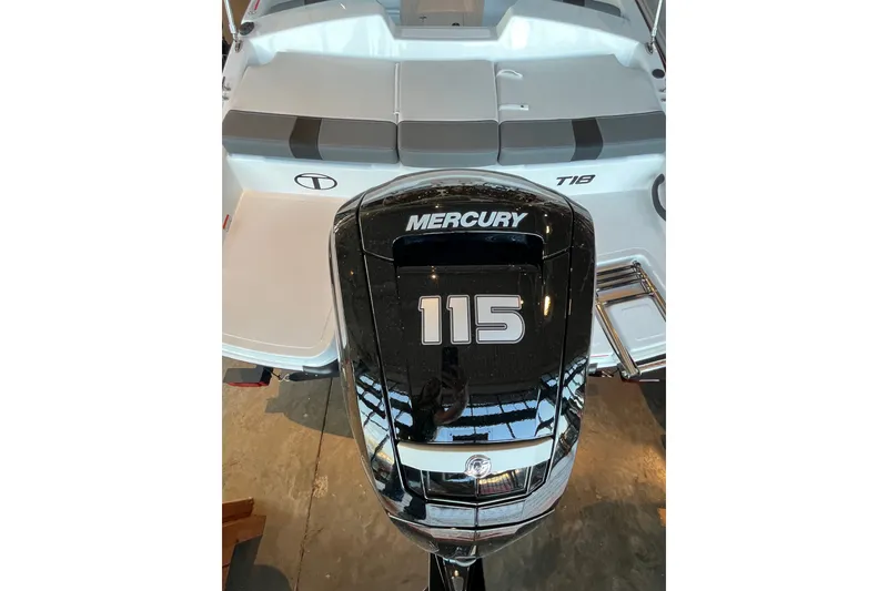 Slide: The Image of 2027 Tahoe T18 boat with Mercury 115 outboard motor, rear view. - 4