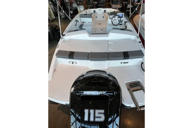 Slide: The Image of 2027 Tahoe T18 boat with Mercury 115 engine, featuring spacious seating and modern design. - 2