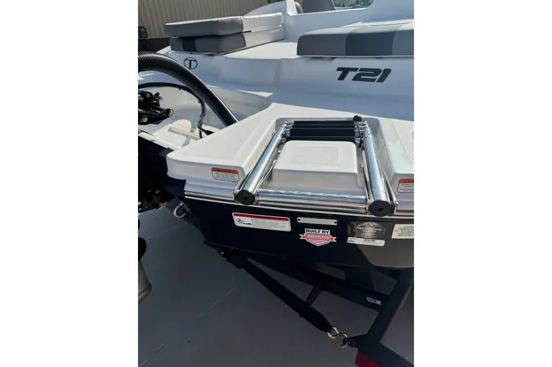 Slide: The Image of 2027 Tahoe T21 boat with ladder and seating area, showcasing sleek design and functionality. - 9