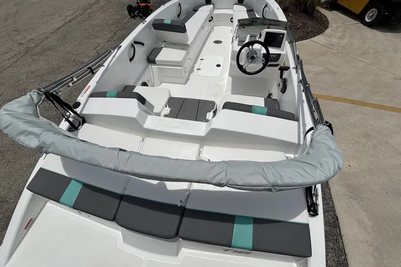 Slide: The Image of 2027 Tahoe T18 boat interior with modern seating and steering console. - 10