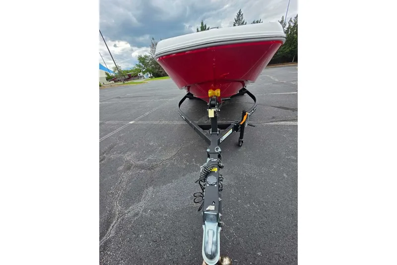 Slide: The Image of Front view of a 2027 Tahoe T18 boat on a trailer in a parking lot. - 8