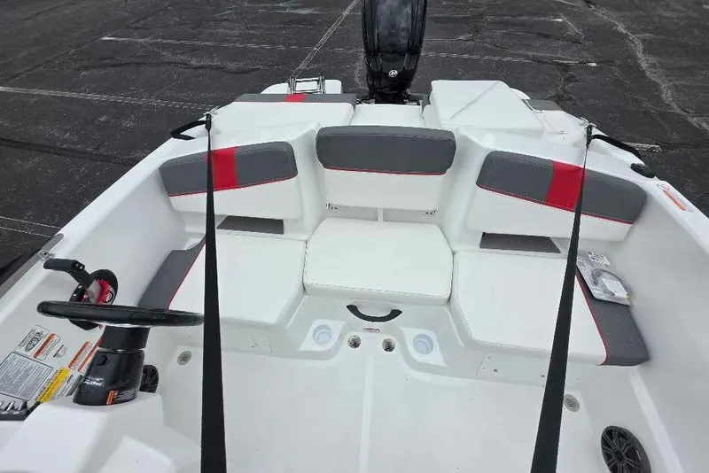 Slide: The Image of Interior view of a 2027 Tahoe T18 boat with seating and steering wheel. - 11