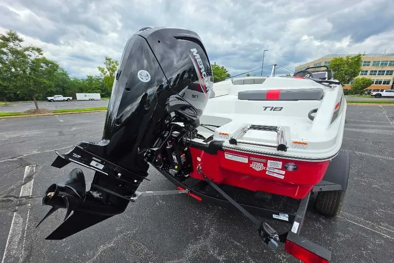 Slide: The Image of 2027 Tahoe T18 boat with Mercury outboard motor in a parking lot. - 3