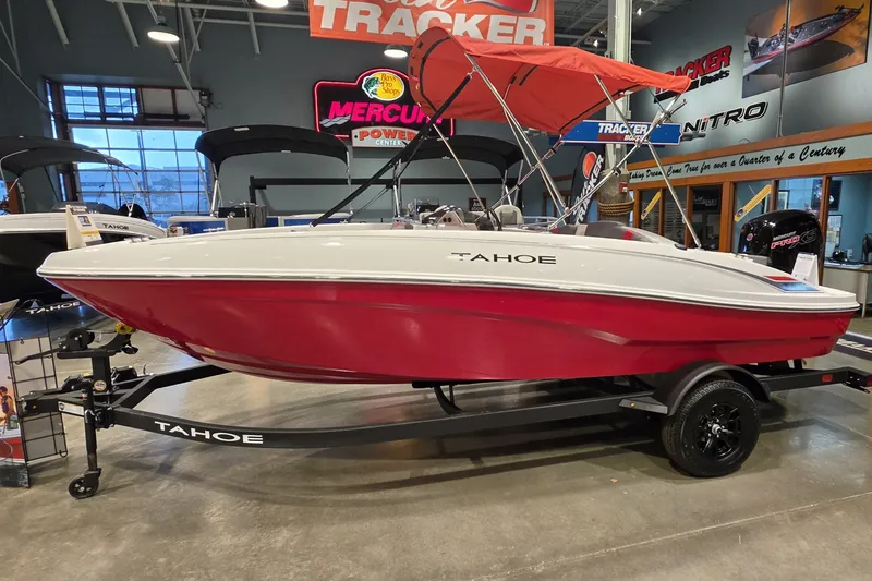 The Image of 2027 Tahoe T18 boat with red hull and canopy on display in showroom. - 0