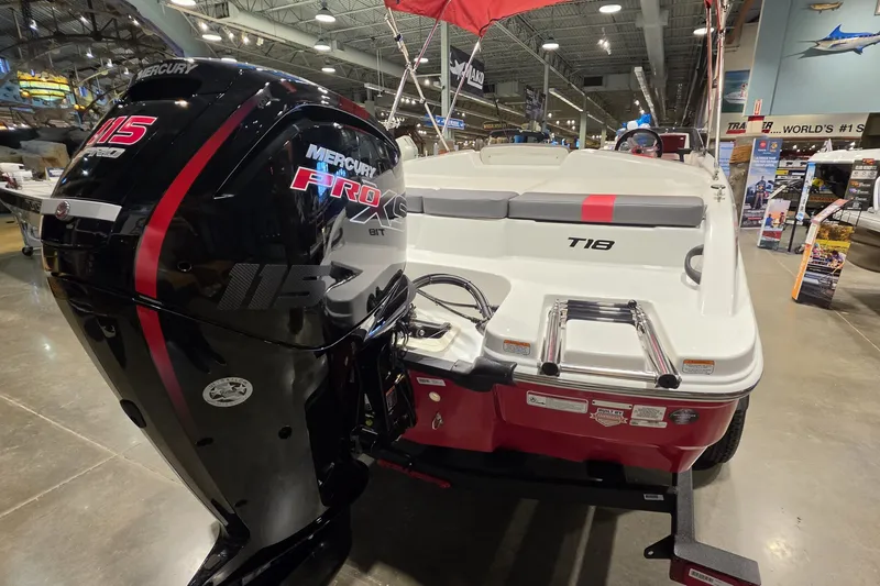 Slide: The Image of 2027 Tahoe T18 boat with Mercury Pro XS 115 engine displayed indoors. - 7