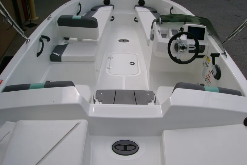 Slide: The Image of 2027 Tahoe T18 boat interior with seating, steering wheel, and control panel. - 9