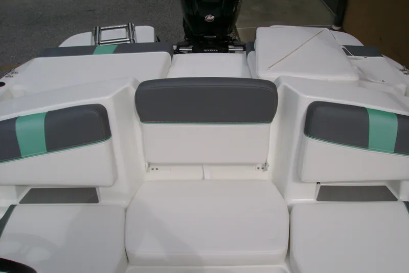Slide: The Image of 2027 Tahoe T18 boat interior with gray and teal seating, featuring a sleek design. - 11