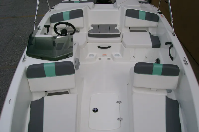 Slide: The Image of 2027 Tahoe T18 boat interior with seating and steering wheel. - 8