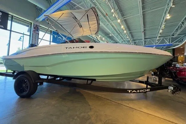 The Image of 2027 Tahoe T18 boat with canopy on display in showroom. - 0