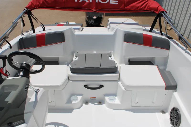 Slide: The Image of Interior of 2027 Tahoe T18 boat with red and gray seating and steering wheel. - 9