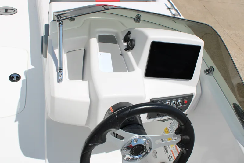 Slide: The Image of 2027 Tahoe T18 boat dashboard with steering wheel and control panel. - 8