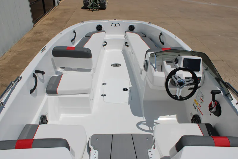 Slide: The Image of 2027 Tahoe T18 boat interior with modern seating and steering console. - 7