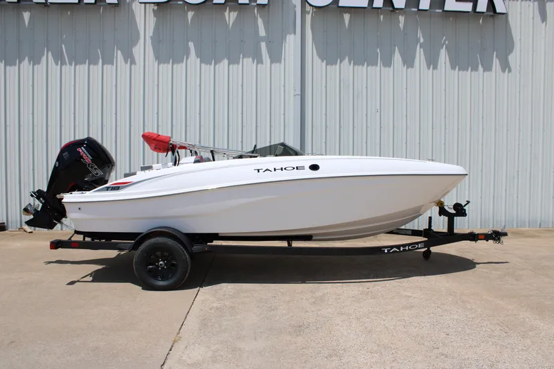 The Image of 2027 Tahoe T18 boat on trailer, white exterior, parked outdoors. - 0